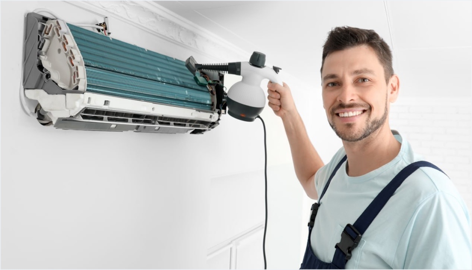 Technician servicing an AC unit in Edmonton